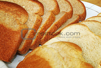 Light and Dark Wheat Bread Slices on Plate
