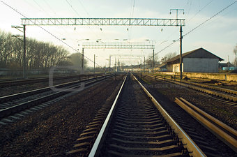 Railway station and rails seeking to distance