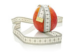 Apple wrapped with measuring tape