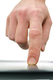 Front view of male finger using touch pad