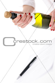 Woman opening a bottle of wine