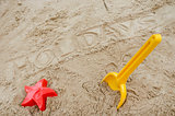 Holidays written in sand