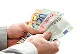 Closeup of a man holding Euro money banknotes