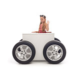 Travel concept with little girl and wheeled box