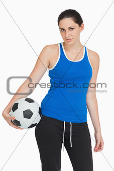 Sportswoman with a football