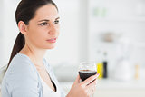 Brunette holding a red wine glass