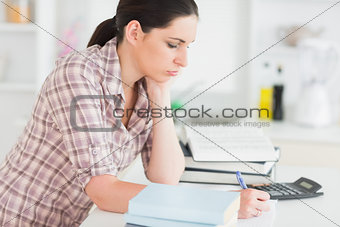 Serious woman studying