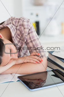 Woman leaning on the table and resting