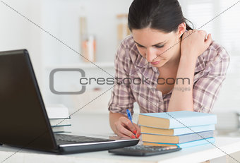Woman working next to a computer