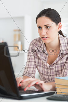 Woman typing on a computer
