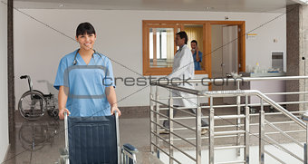 Doctors assistant pushing a wheelchair