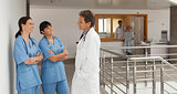 Doctor and two nurses discoursing in a hospital