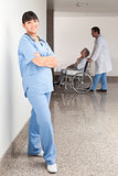 Proud nurse standing in the hallway