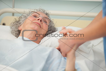 Nurse caring about old woman