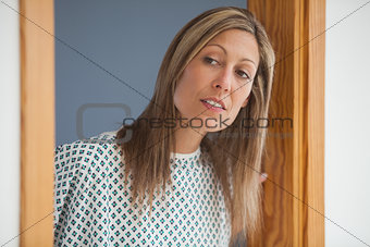Female patient looking through doorway