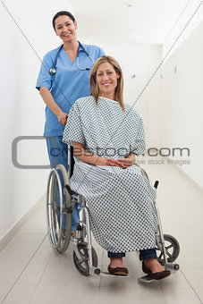 Happy nurse and patient in wheelchair
