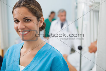 Smiling nurse in hospital room