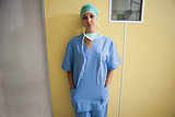 Nurse in scrubs standing in hospital room