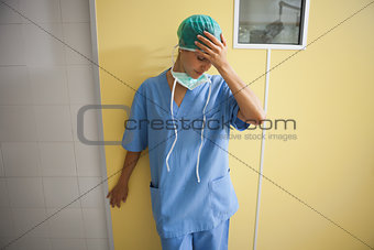 Nurse in scrubs looking worried