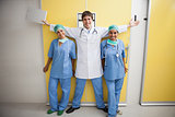 Happy doctor between two smiling nurses