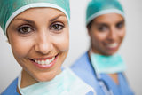 smiling nurse in surgical cap