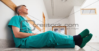 Surgeon sitting on the floor