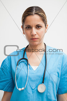 Nurse is looking into the camera