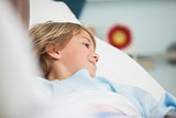 Child lying in hospital bed
