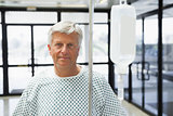 Patient standing in the corridor with IV drip