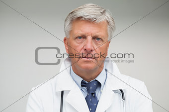 Mature doctor looking serious