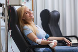 Smiling woman donating blood