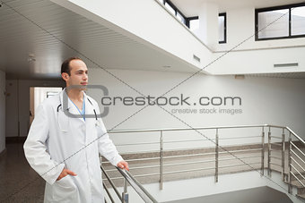 Doctor on stairwell looking ahead