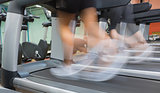 People jogging on a treadmill