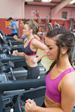 People exercising in the gym on treadmills