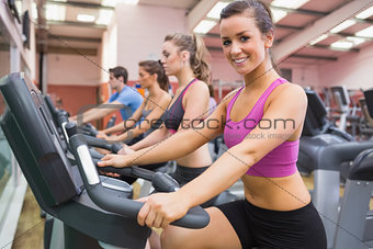 Woman smiling on exercise bicycle