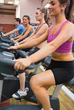 People exercising on exercise bicycles