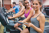 Instructor and woman smiling in the gym