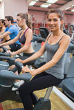 Woman smiling at camera in the gym