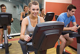 Smiling woman in spin class