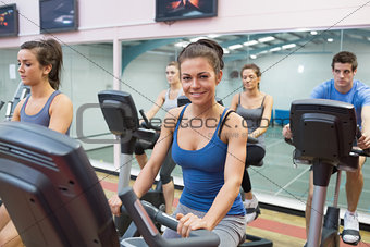 Woman smiling at spinning class
