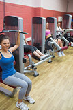 Women training in weights room