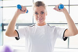 Female trainer lifting weights