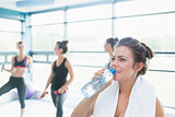 Women drinking  water in aerobics class
