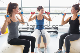 Three woman on exercise balls
