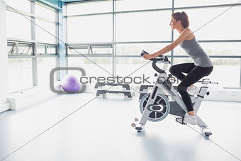 Woman riding an exercise bike