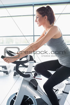 Woman riding an exercise bike