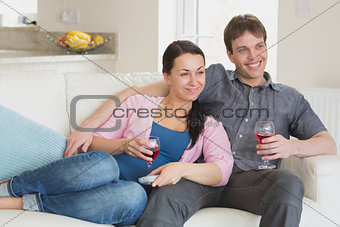 Young relaxing couple drinking wine