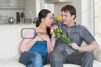 Man giving woman flowers