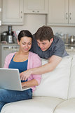 Young couple using the laptop