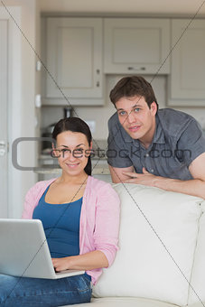 Woman working on the laptop on the couch
